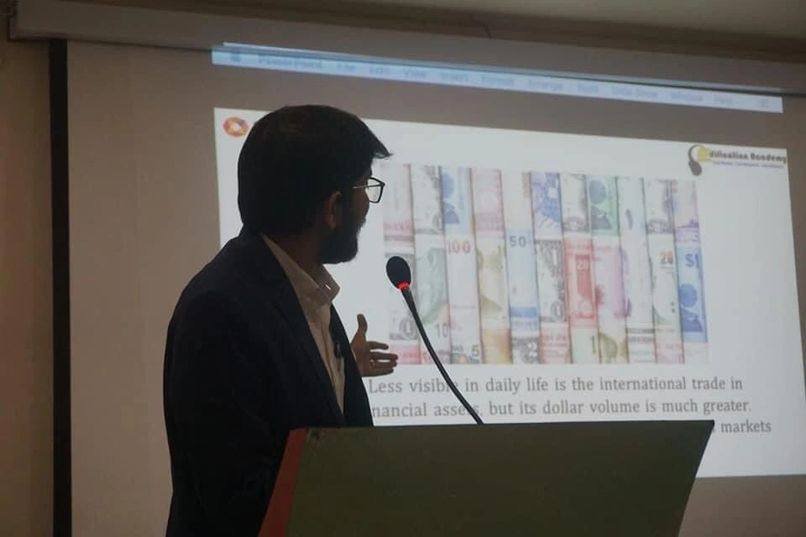Alok Daiya speaking at a financial conference